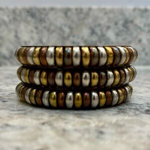 3 Bangles in Copper, Bronze, Silver. Slip over hand to wrist.